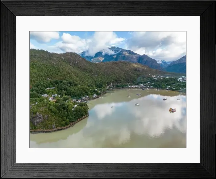Framed Print : Drone view of Caleta Tortel with its small cabins - Discovering the beautiful village while traveling the Carretera Framed Print : Drone view of Caleta Tortel with its small cabins - Discovering the beautiful village while traveling the Carretera