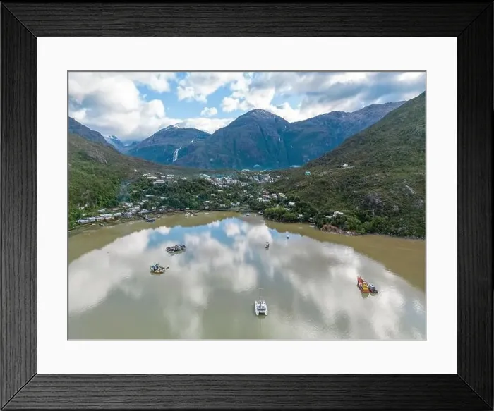 Framed Print : Drone view of Caleta Tortel with its small cabins - Discovering the beautiful village while traveling the Carretera Framed Print : Drone view of Caleta Tortel with its small cabins - Discovering the beautiful village while traveling the Carretera