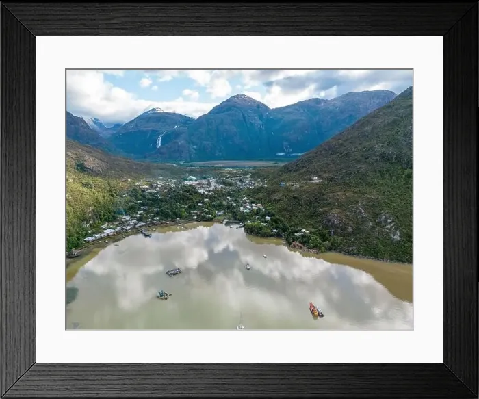 Framed Print : Drone view of Caleta Tortel with its small cabins - Discovering the beautiful village while traveling the Carretera Framed Print : Drone view of Caleta Tortel with its small cabins - Discovering the beautiful village while traveling the Carretera
