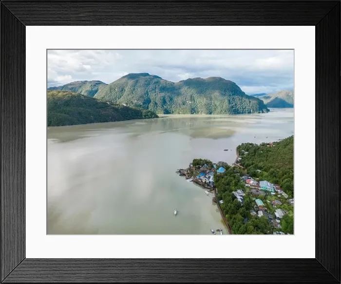 Framed Print : Drone view of Caleta Tortel with its small cabins - Discovering the beautiful village while traveling the Carretera Framed Print : Drone view of Caleta Tortel with its small cabins - Discovering the beautiful village while traveling the Carretera