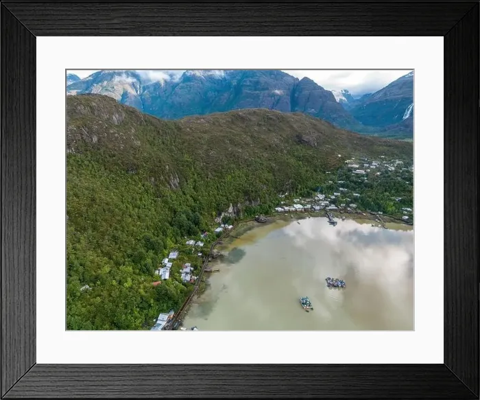 Framed Print : Drone view of Caleta Tortel with its small cabins - Discovering the beautiful village while traveling the Carretera Framed Print : Drone view of Caleta Tortel with its small cabins - Discovering the beautiful village while traveling the Carretera