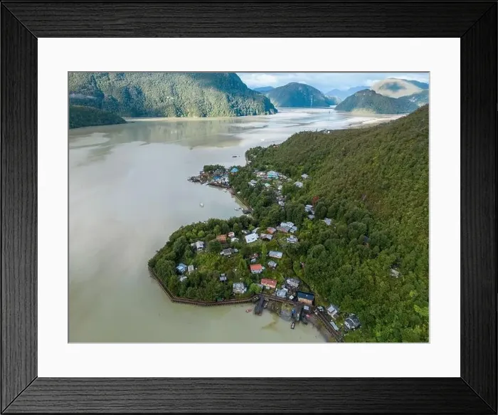 Framed Print : Drone view of Caleta Tortel with its small cabins - Discovering the beautiful village while traveling the Carretera Framed Print : Drone view of Caleta Tortel with its small cabins - Discovering the beautiful village while traveling the Carretera