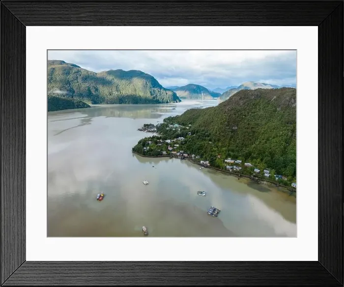 Framed Print : Drone view of Caleta Tortel with its small cabins - Discovering the beautiful village while traveling the Carretera Framed Print : Drone view of Caleta Tortel with its small cabins - Discovering the beautiful village while traveling the Carretera