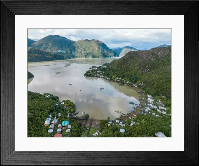 Framed Print : Drone view of Caleta Tortel with its small cabins - Discovering the beautiful village while traveling the Carretera Framed Print : Drone view of Caleta Tortel with its small cabins - Discovering the beautiful village while traveling the Carretera