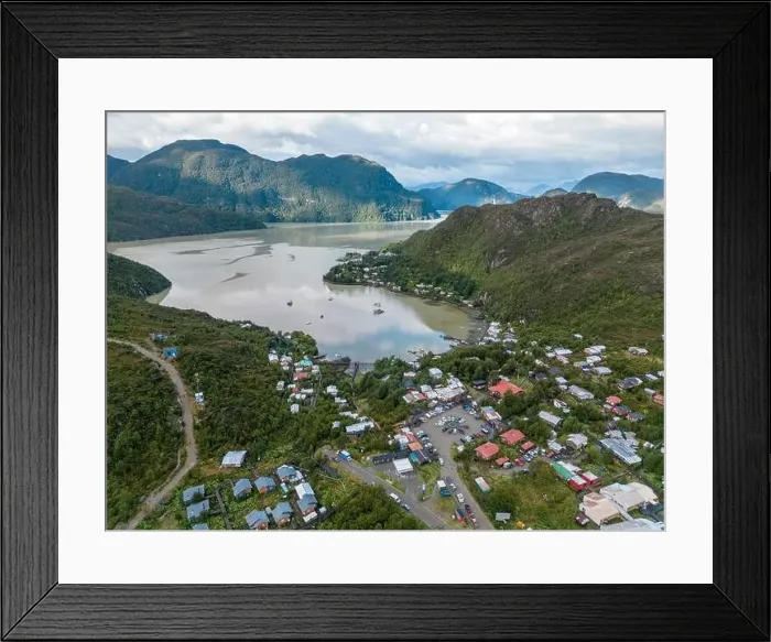 Framed Print : Drone view of Caleta Tortel with its small cabins - Discovering the beautiful village while traveling the Carretera Framed Print : Drone view of Caleta Tortel with its small cabins - Discovering the beautiful village while traveling the Carretera