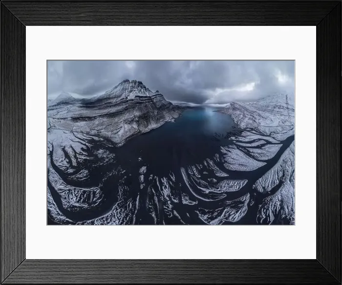 Framed Print : Scenic aerial view of river estuary located in valley near snowy mountain range on cold winter day in southeast Iceland Framed Print : Scenic aerial view of river estuary located in valley near snowy mountain range on cold winter day in southeast Iceland