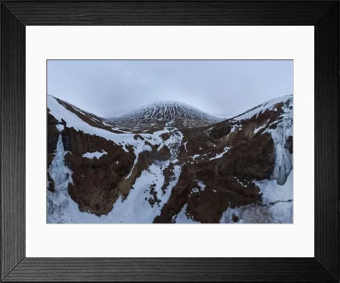 Framed Print : Wide angle drone view of snowy mountains under cloudy gloomy sky in Iceland Framed Print : Wide angle drone view of snowy mountains under cloudy gloomy sky in Iceland