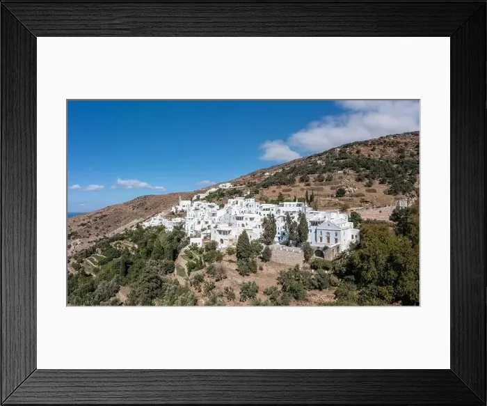 Framed Print : Cyclades, Greece. Tinos Greek island, aerial drone view of Kardiani village town, white color buildings, cloudy blue sky Framed Print : Cyclades, Greece. Tinos Greek island, aerial drone view of Kardiani village town, white color buildings, cloudy blue sky