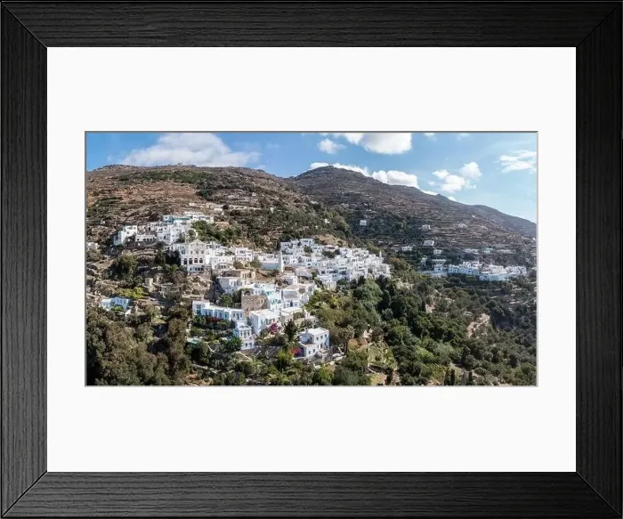 Framed Print : Cyclades, Greece. Tinos Greek island, aerial drone view of Kardiani village town, white color buildings, cloudy blue sky Framed Print : Cyclades, Greece. Tinos Greek island, aerial drone view of Kardiani village town, white color buildings, cloudy blue sky