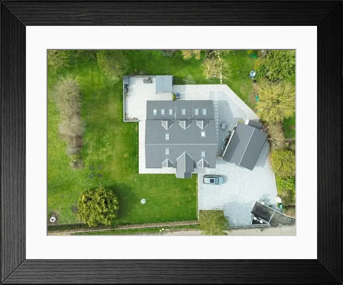 Framed Print : Aerial view of a large, recently built house which was built onto a previous bungalow