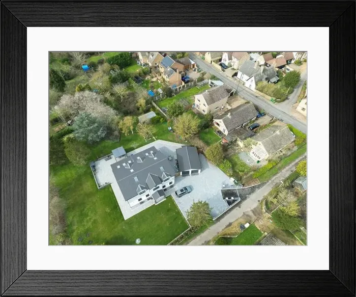 Framed Print : Aerial view of a large, recently built house which was built onto a previous bungalow