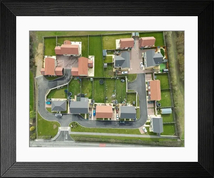 Framed Print : Top down drone view of a small housing development at the edge of an East Anglian village Framed Print : Top down drone view of a small housing development at the edge of an East Anglian village