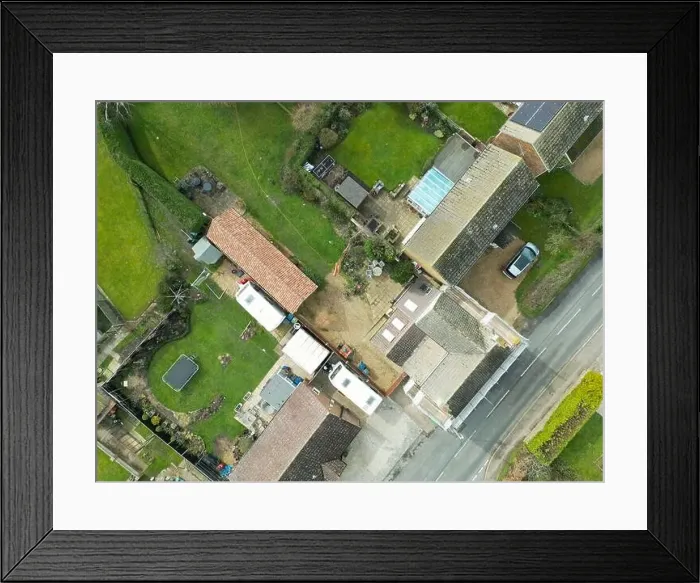 Framed Print : Top down view of a mixture of old and modern houses and bungalows seen at the edge of an East Anglian village Framed Print : Top down view of a mixture of old and modern houses and bungalows seen at the edge of an East Anglian village