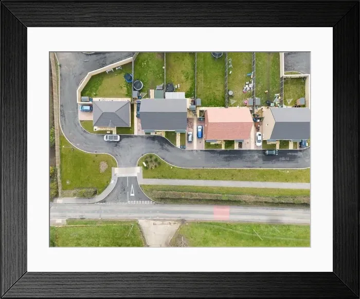 Framed Print : Drone top down view of a new housing development previously on a brown field site in the heart of the English Framed Print : Drone top down view of a new housing development previously on a brown field site in the heart of the English