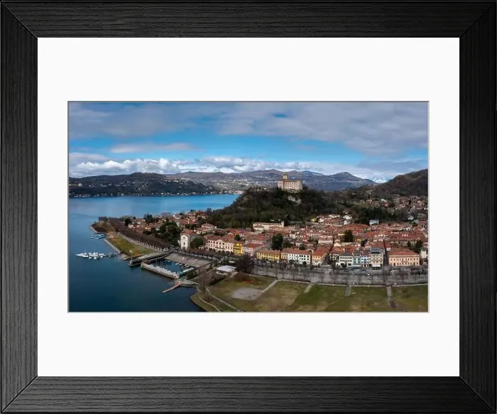 Framed Print : Angera, Italy - 14 March, 2023: view of Angera and the Borromeo Castle on the shores of Lake Maggiore Framed Print : Angera, Italy - 14 March, 2023: view of Angera and the Borromeo Castle on the shores of Lake Maggiore