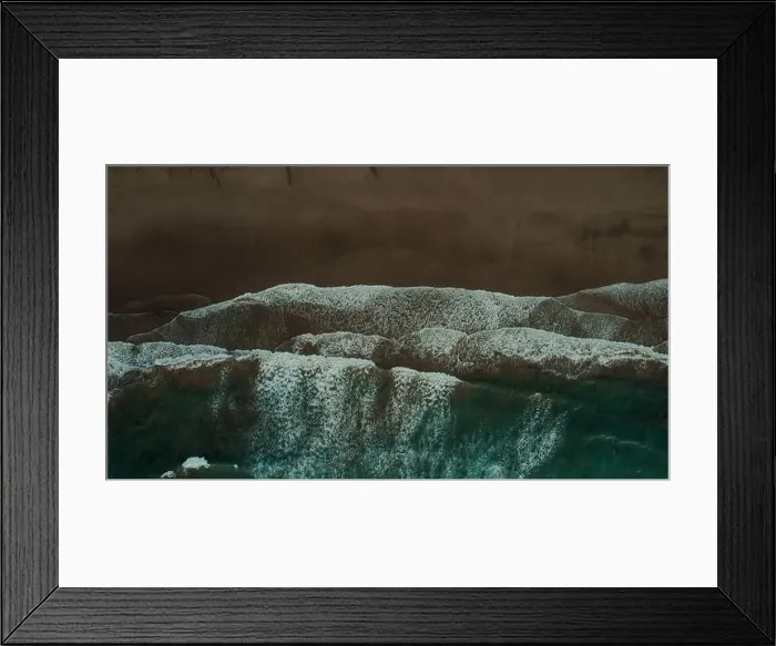Framed Print : Breathtaking aerial view of foamy waves of ocean rolling on sandy beach on gloomy day in Lanzarote Framed Print : Breathtaking aerial view of foamy waves of ocean rolling on sandy beach on gloomy day in Lanzarote