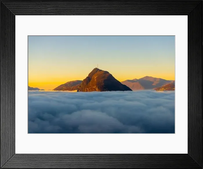 Framed Print : Mountain Peak San Salvatore Above Cloudscape with Sunlight and Clear Sky in Lugano, Ticino in Switzerland Framed Print : Mountain Peak San Salvatore Above Cloudscape with Sunlight and Clear Sky in Lugano, Ticino in Switzerland