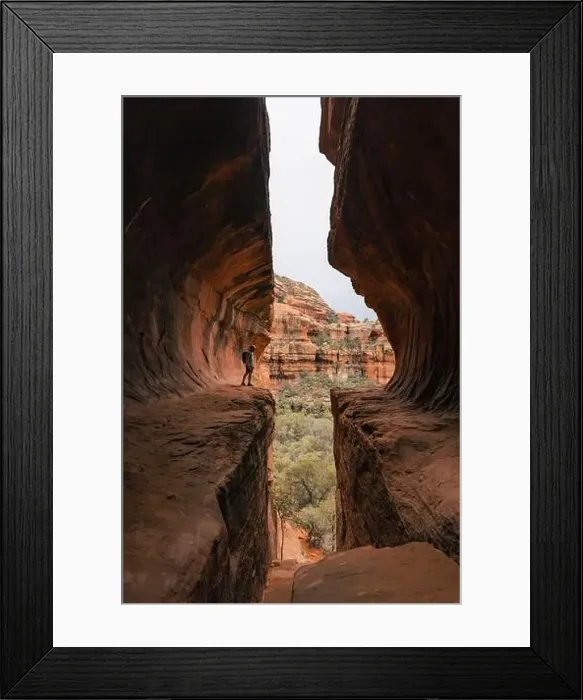 Framed Print : Young man hiker stands in Subway Cave in Boynton Canyon Sedona Arizona Framed Print : Young man hiker stands in Subway Cave in Boynton Canyon Sedona Arizona