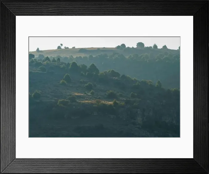 Framed Print : Precipice with trees on top and rocky area with sunrise sunshine Framed Print : Precipice with trees on top and rocky area with sunrise sunshine