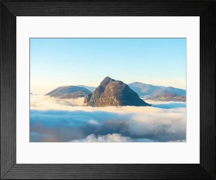 Framed Print : Mountain Peak San Salvatore Above Cloudscape with Sunlight and Clear Sky in Lugano, Ticino in Switzerland Framed Print : Mountain Peak San Salvatore Above Cloudscape with Sunlight and Clear Sky in Lugano, Ticino in Switzerland