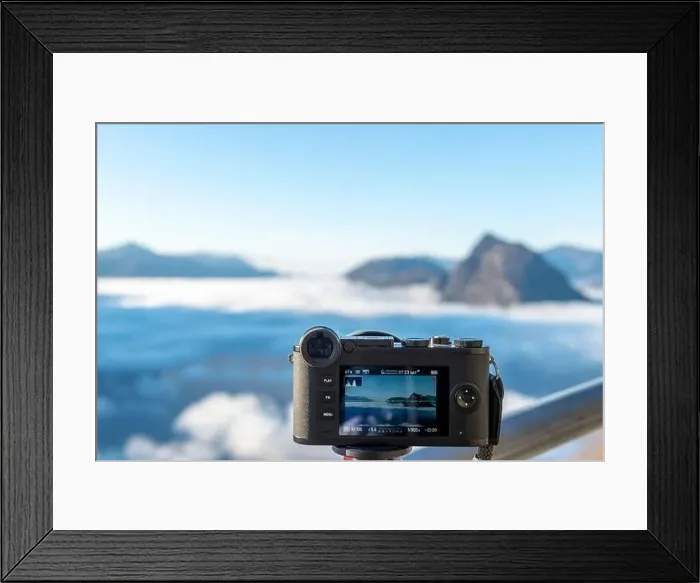 Framed Print : Camera Filming Mountain Peak San Salvatore Above Cloudscape with Sunlight and Clear Sky in Lugano Framed Print : Camera Filming Mountain Peak San Salvatore Above Cloudscape with Sunlight and Clear Sky in Lugano