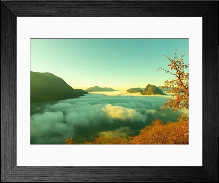 Framed Print : Mountain Peak San Salvatore Above Cloudscape with a Autumn Tree and Sunlight with Clear Sky in Lugano Framed Print : Mountain Peak San Salvatore Above Cloudscape with a Autumn Tree and Sunlight with Clear Sky in Lugano