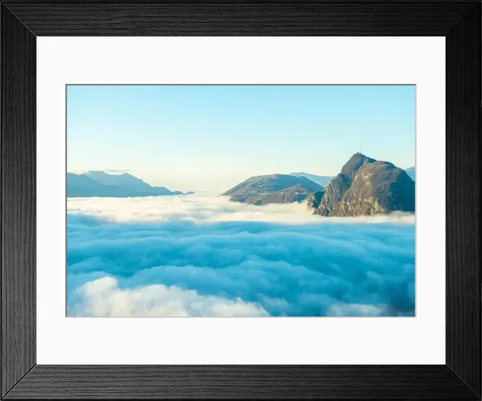 Framed Print : Mountain Peak San Salvatore Above Cloudscape with Sunlight and Clear Sky in Lugano, Ticino in Switzerland Framed Print : Mountain Peak San Salvatore Above Cloudscape with Sunlight and Clear Sky in Lugano, Ticino in Switzerland