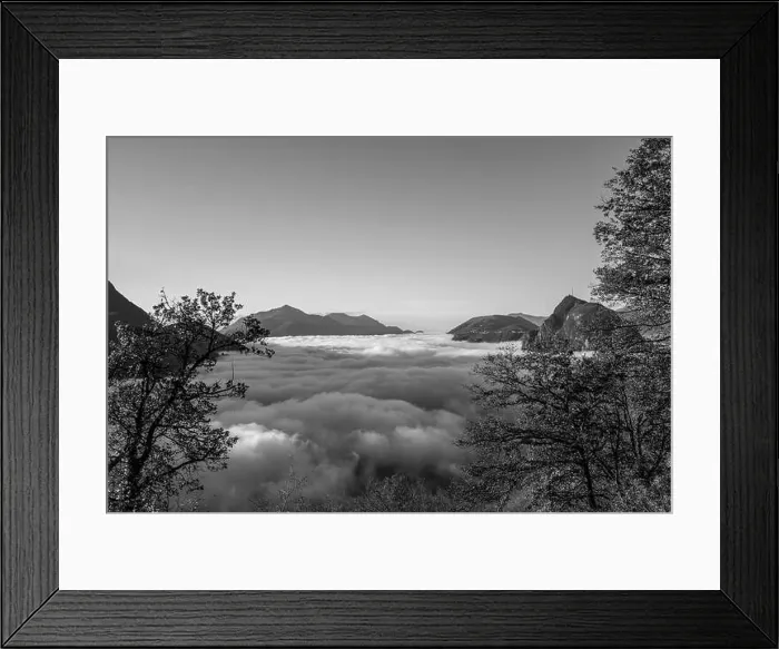 Framed Print : Mountain Peak San Salvatore Above Cloudscape with a Autumn Tree and Sunlight with Clear Sky in Lugano Framed Print : Mountain Peak San Salvatore Above Cloudscape with a Autumn Tree and Sunlight with Clear Sky in Lugano