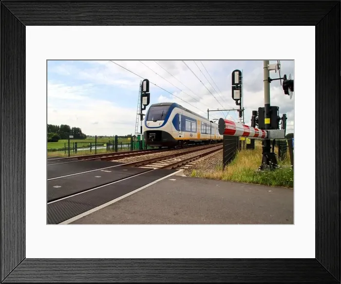 Framed Print : SLT sprinter local commuter train on track in Moordrecht in the Netherlands Framed Print : SLT sprinter local commuter train on track in Moordrecht in the Netherlands