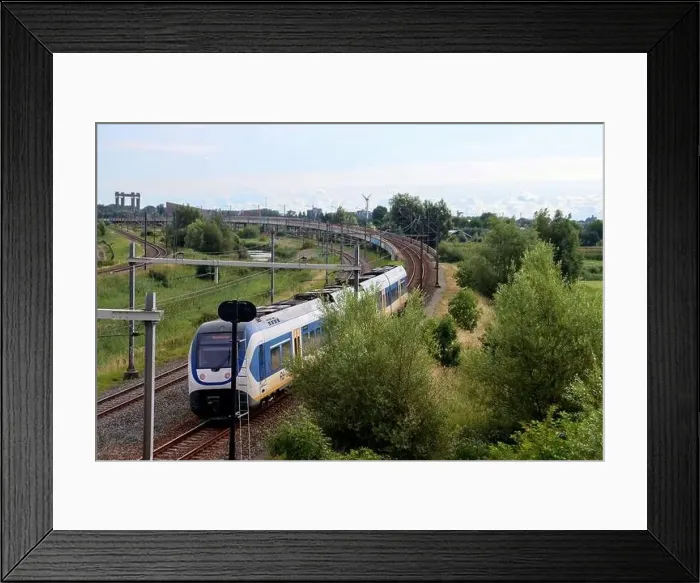 Framed Print : SLT sprinter local commuter train on track in Moordrecht in the Netherlands Framed Print : SLT sprinter local commuter train on track in Moordrecht in the Netherlands