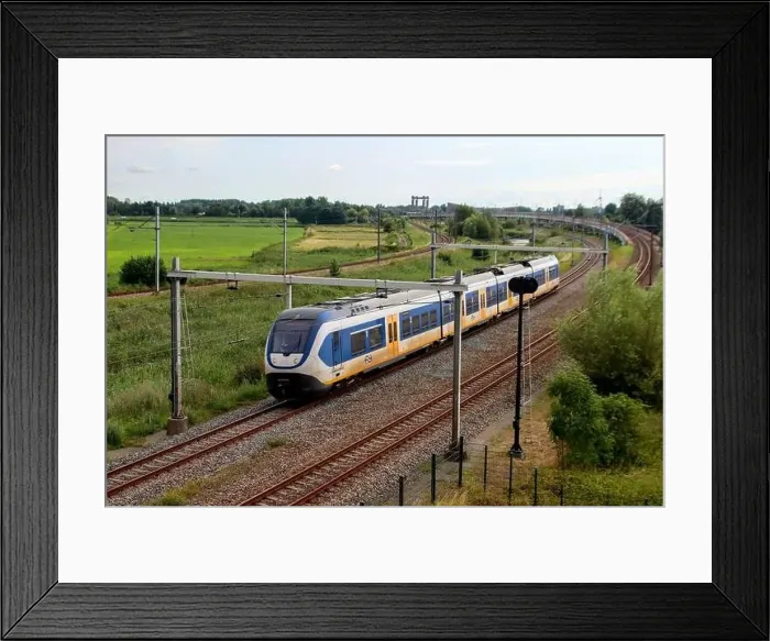 Framed Print : SLT sprinter local commuter train on track in Moordrecht in the Netherlands Framed Print : SLT sprinter local commuter train on track in Moordrecht in the Netherlands