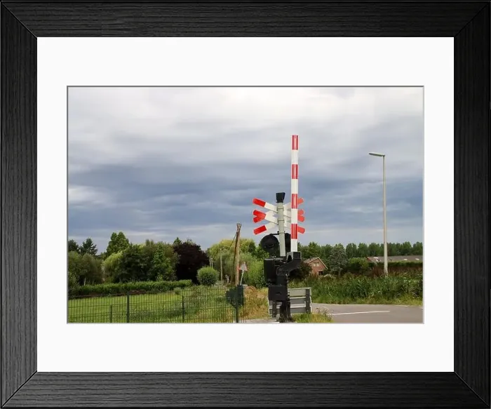 Framed Print : Barriers and red lights at railroad crossing in Moordrecht in the Netherlands Framed Print : Barriers and red lights at railroad crossing in Moordrecht in the Netherlands