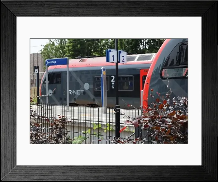 Framed Print : Red and black trains of R-Net at train station Boskoop between alphen and gouda Framed Print : Red and black trains of R-Net at train station Boskoop between alphen and gouda