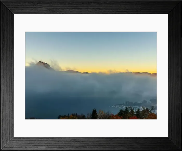 Framed Print : Mountain Peak San Salvatore Above Cloudscape and Lake Lugano with Sunlight and Clear Sky in City of Lugano Framed Print : Mountain Peak San Salvatore Above Cloudscape and Lake Lugano with Sunlight and Clear Sky in City of Lugano