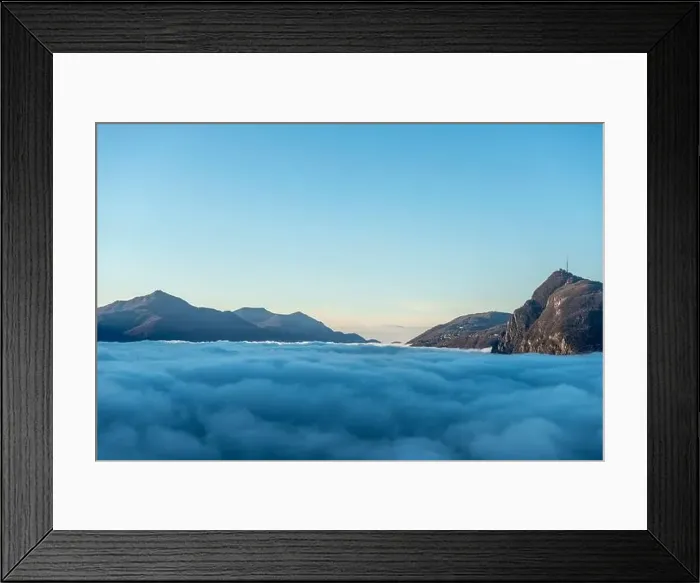 Framed Print : Mountain Peak San Salvatore Above Cloudscape with Sunlight and Clear Sky in Lugano, Ticino in Switzerland