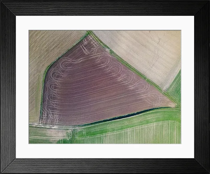 Framed Print : a small freshly plowed field, view from a drone in spring in germany, Aerial top view Framed Print : a small freshly plowed field, view from a drone in spring in germany, Aerial top view