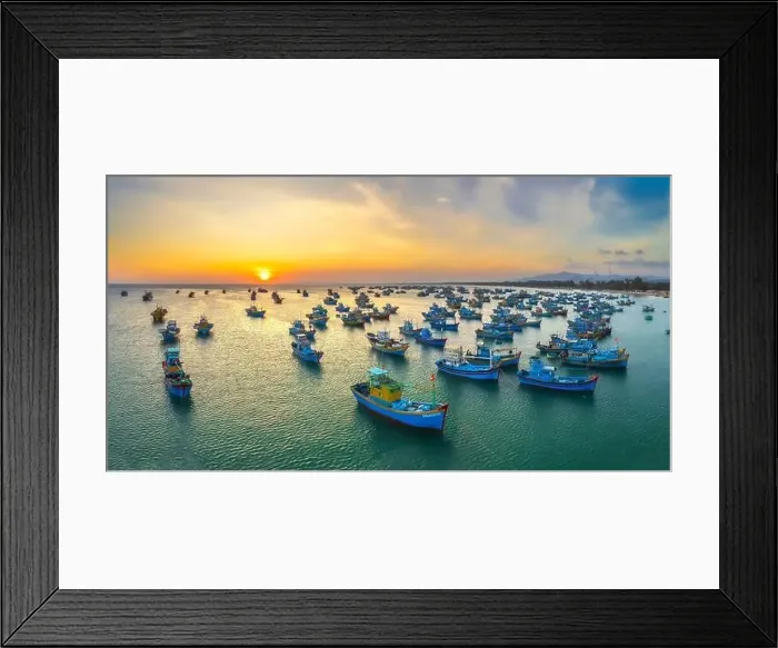 Framed Print : Aerial view of Mui Ne fishing village in sunset sky with hundreds of boats anchored to avoid storms Framed Print : Aerial view of Mui Ne fishing village in sunset sky with hundreds of boats anchored to avoid storms