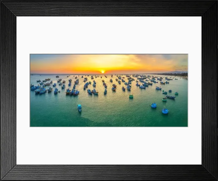 Framed Print : Aerial view of Mui Ne fishing village in sunset sky with hundreds of boats anchored to avoid storms Framed Print : Aerial view of Mui Ne fishing village in sunset sky with hundreds of boats anchored to avoid storms