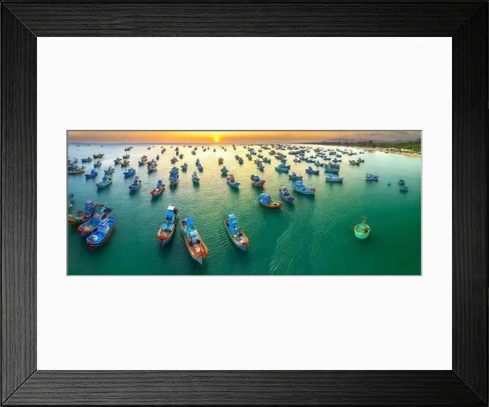 Framed Print : Aerial view of Mui Ne fishing village in sunset sky with hundreds of boats anchored to avoid storms Framed Print : Aerial view of Mui Ne fishing village in sunset sky with hundreds of boats anchored to avoid storms