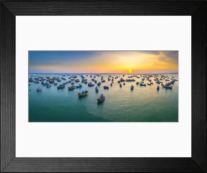 Framed Print : Aerial view of Mui Ne fishing village in sunset sky with hundreds of boats anchored to avoid storms