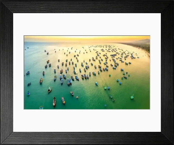 Framed Print : Aerial view of Mui Ne fishing village in sunset sky with hundreds of boats anchored to avoid storms Framed Print : Aerial view of Mui Ne fishing village in sunset sky with hundreds of boats anchored to avoid storms