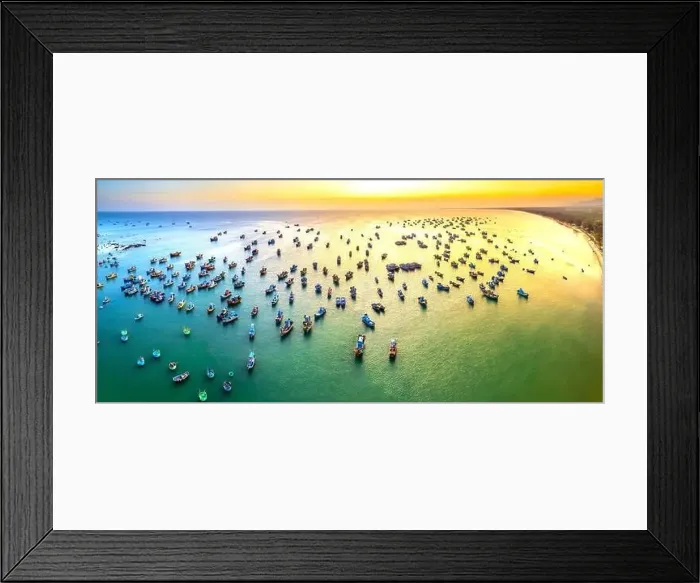 Framed Print : Aerial view of Mui Ne fishing village in sunset sky with hundreds of boats anchored to avoid storms