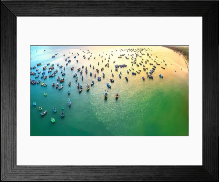 Framed Print : Aerial view of Mui Ne fishing village in the morning with hundreds of boats anchored to avoid storms Framed Print : Aerial view of Mui Ne fishing village in the morning with hundreds of boats anchored to avoid storms