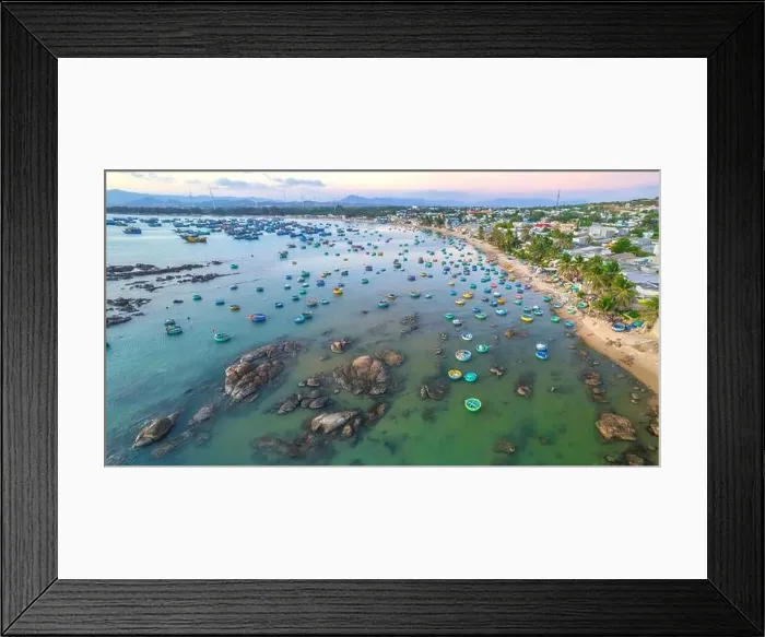 Framed Print : Aerial view of Mui Ne fishing village in the morning with hundreds of boats anchored to avoid storms Framed Print : Aerial view of Mui Ne fishing village in the morning with hundreds of boats anchored to avoid storms