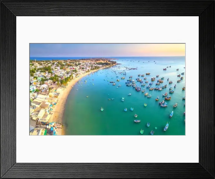 Framed Print : Aerial view of Mui Ne fishing village in the morning with hundreds of boats anchored to avoid storms Framed Print : Aerial view of Mui Ne fishing village in the morning with hundreds of boats anchored to avoid storms