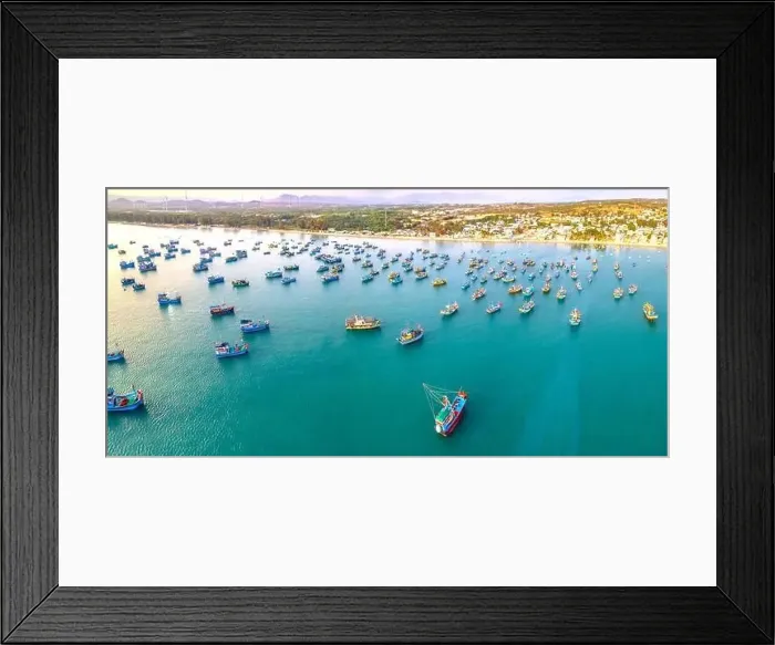 Framed Print : Aerial view of Mui Ne fishing village in the morning with hundreds of boats anchored to avoid storms Framed Print : Aerial view of Mui Ne fishing village in the morning with hundreds of boats anchored to avoid storms