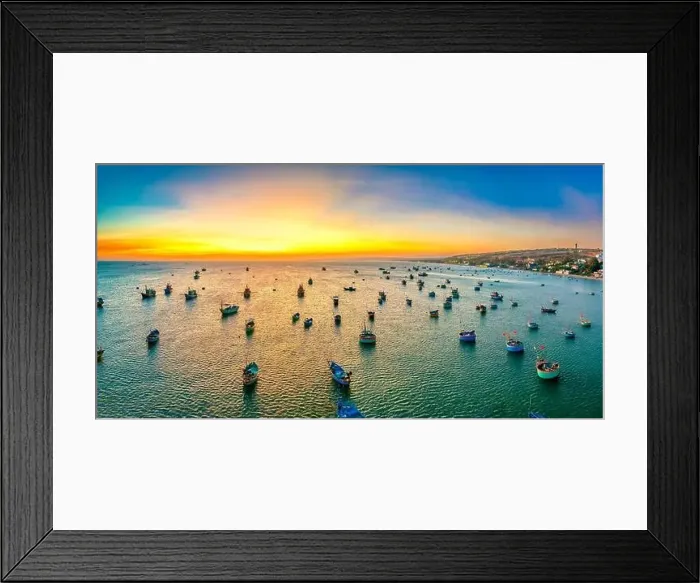 Framed Print : Aerial view of Mui Ne fishing village in sunset sky with hundreds of boats anchored to avoid storms