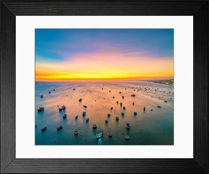 Framed Print : Aerial view of Mui Ne fishing village in sunset sky with hundreds of boats anchored to avoid storms Framed Print : Aerial view of Mui Ne fishing village in sunset sky with hundreds of boats anchored to avoid storms