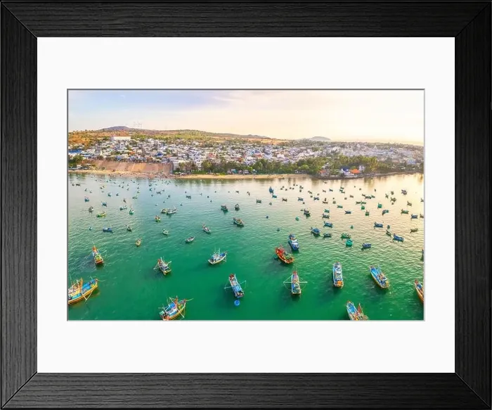 Framed Print : Aerial view of Mui Ne fishing village in the morning with hundreds of boats anchored to avoid storms Framed Print : Aerial view of Mui Ne fishing village in the morning with hundreds of boats anchored to avoid storms