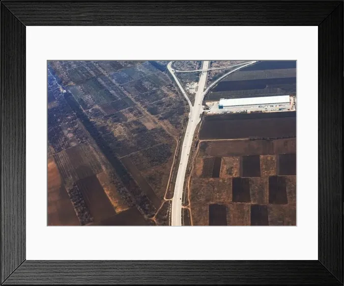 Framed Print : Aerial view of agricultural fields. Plowed lands seen from above Framed Print : Aerial view of agricultural fields. Plowed lands seen from above